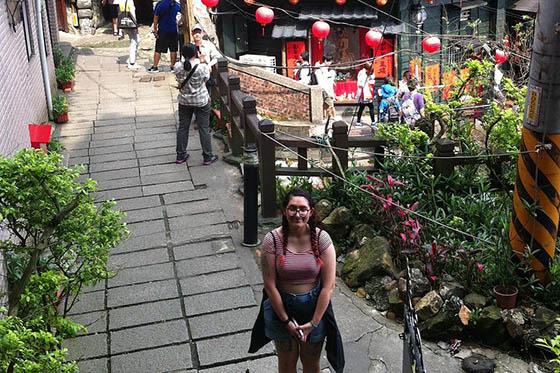 Photo of a young woman posing in a garden in Taiwan