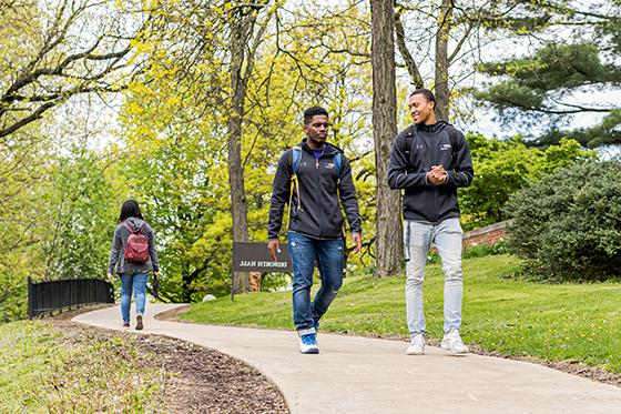 Photos of three Chatham students walking on a campus path